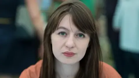 Sally Rooney states she will not travel to the UK due to legal concerns